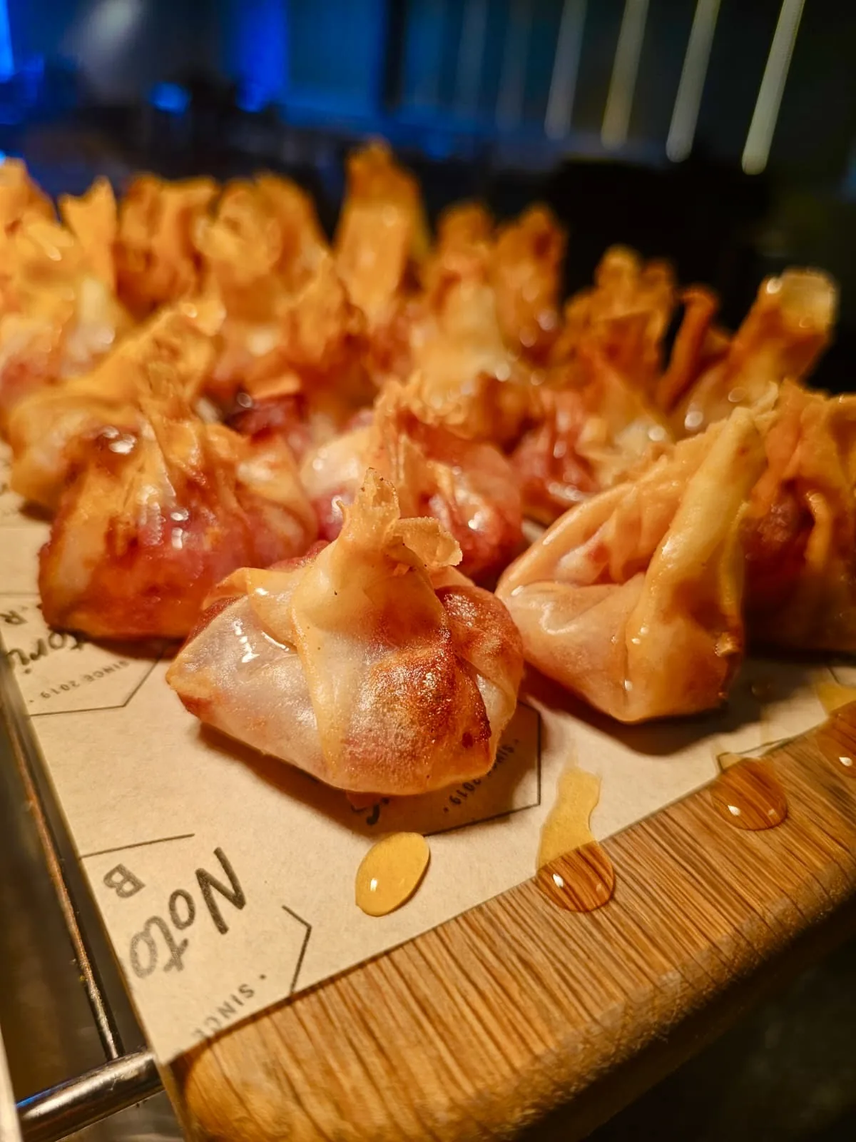 Crispy wontons with a honey drizzle served at a private do in Kent