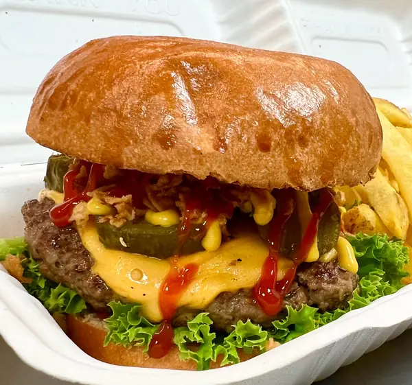 Double cheeseburger and fries in a box