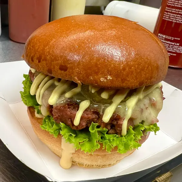 Burger with green sauce